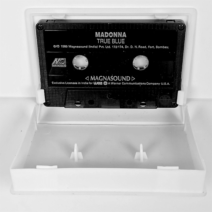 The case open, cassette seated on the spindles