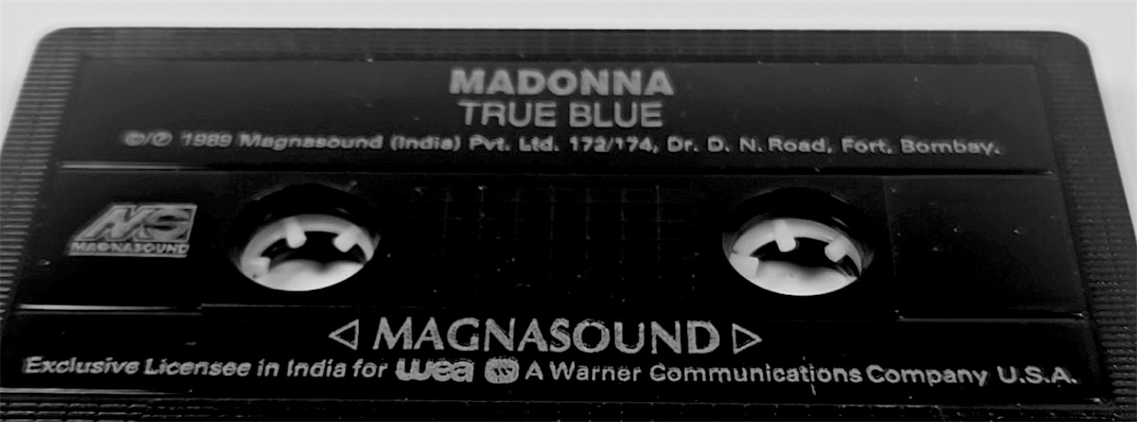 Cassette shell: Madonna, True Blue. 1989 Magnasound (India) Pvt. Ltd., 172/174 Dr. D. N. Road, Fort, Bombay. Exclusive Licensee in India for WEA, a Warner Communications Company U.S.A.
